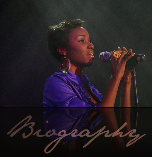 Alexis Joi singing on stage, from her archived biography
